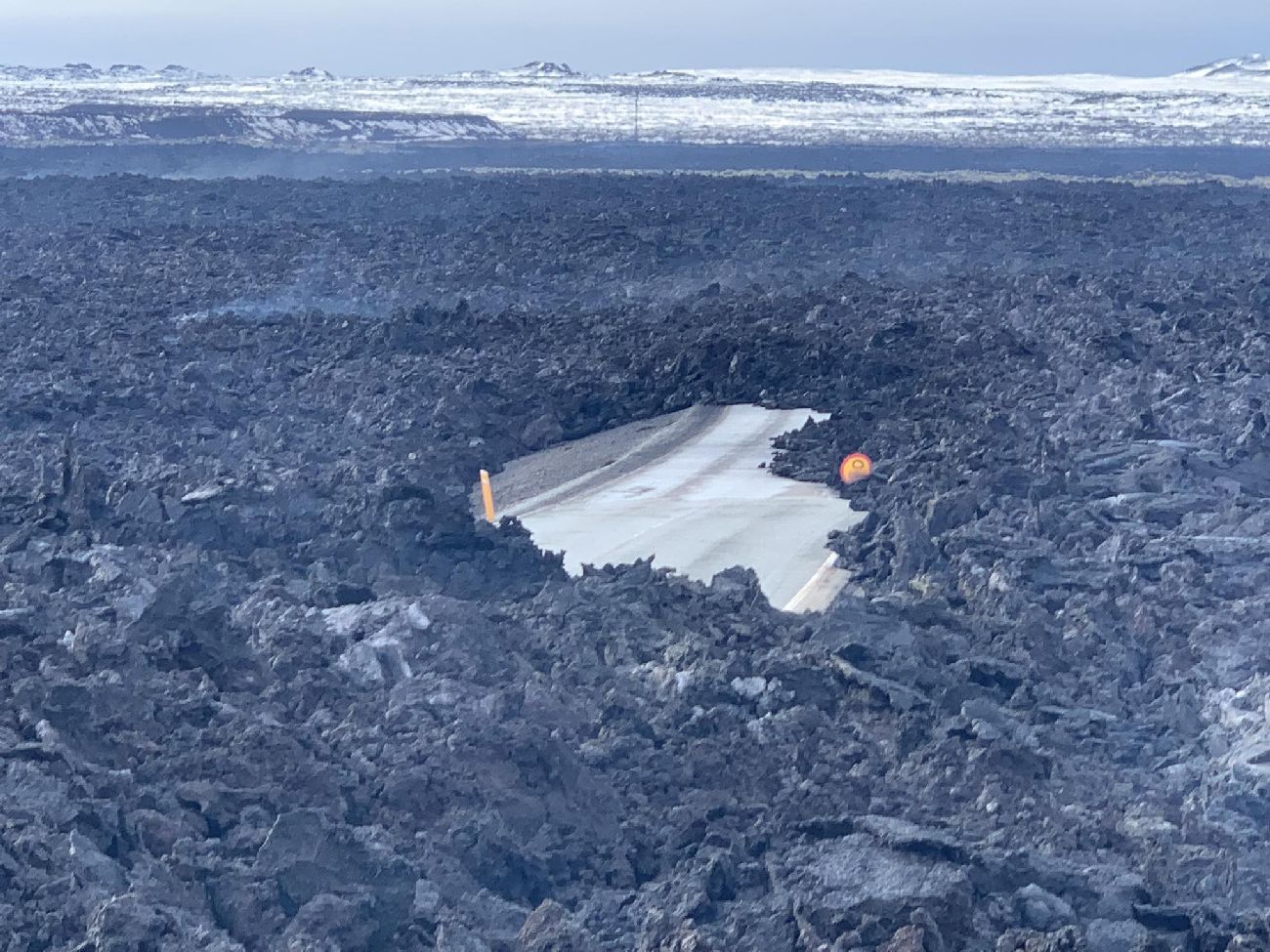 The old road to Grindavík (43) under fresh lava.
